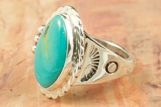 Genuine Manassa Turquoise set in Sterling Silver Ring. This Turquoise is also referred to as King�s Manassa Turquoise. The Manassa Turquoise mine is located in Manassa, Conejos County, Colorado. Created by Navajo Artist Tony Garcia. Signed by the artist.